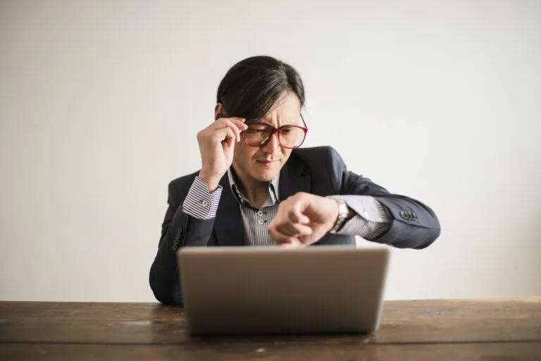 A man checking his watch for the time. Photo by Andrea Piacquadio: https://www.pexels.com/photo/confused-businessman-checking-time-on-wristwatch-3760810/