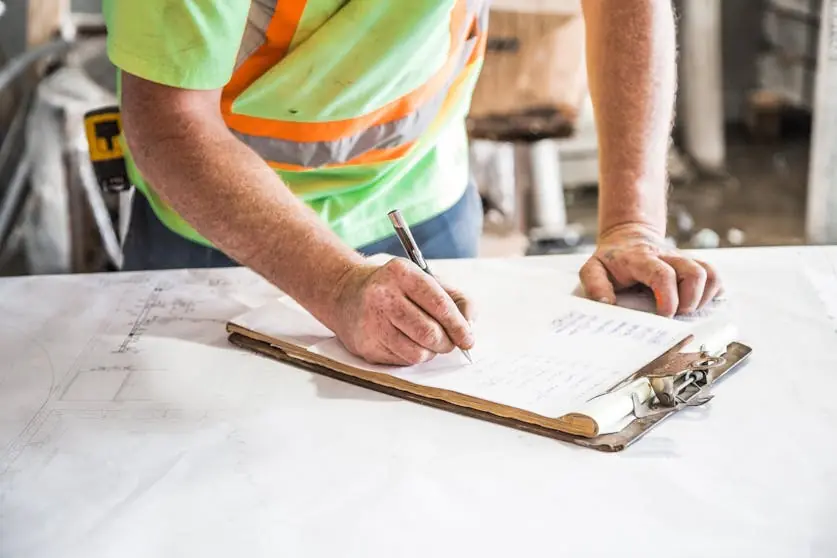 Construction worker with manual time tracking.
